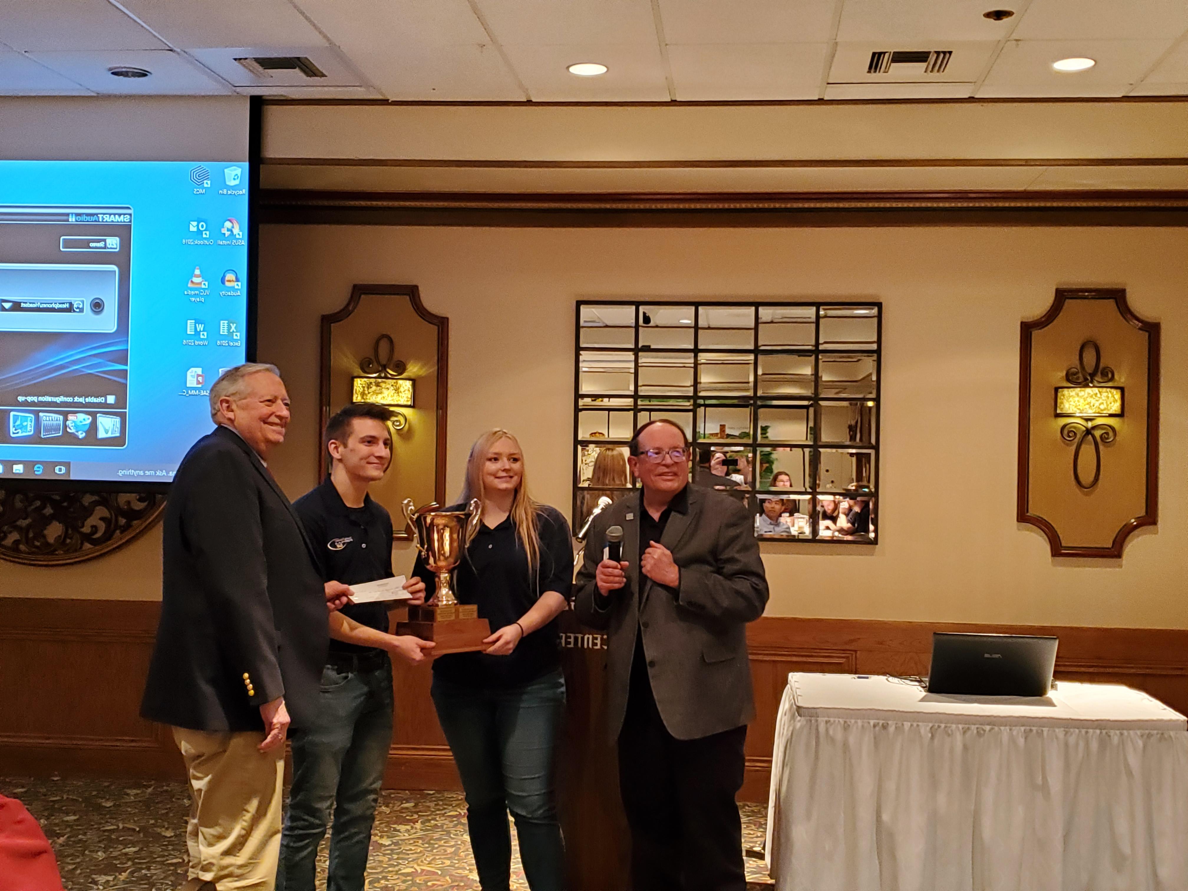 Members of the Kettering University Formula SAE team receiving the Collegiate Cup.